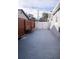 Spacious driveway with a secure gate and wooden fence at 314 E Althea Ave, Tampa, FL 33612