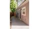 Side exterior of a home featuring a narrow walkway and privacy fence at 314 E Althea Ave, Tampa, FL 33612