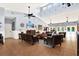 Comfortable clubhouse lounge area with sofas, TV, and access to an outdoor pool at 31833 Turkeyhill Dr, Wesley Chapel, FL 33543