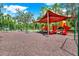 Enjoy the playground with swings, slides and climbing equipment surrounded by landscaping at 31833 Turkeyhill, Wesley Chapel, FL 33543