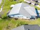 Aerial view of a charming single-story home with well-maintained landscaping and a classic, neutral-toned roof at 3346 Gorse Ct, Palm Harbor, FL 34684