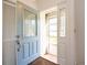 Inviting entryway with decorative glass door and tile flooring at 3346 Gorse Ct, Palm Harbor, FL 34684