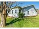 Exterior view of this single story home featuring mature landscaping and well maintained lawn at 3346 Gorse Ct, Palm Harbor, FL 34684