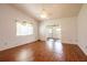 Bright living room with wood flooring and a ceiling fan at 3346 Gorse Ct, Palm Harbor, FL 34684