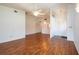 Open-concept living room featuring wood floors, neutral walls and ceiling fan at 3346 Gorse Ct, Palm Harbor, FL 34684