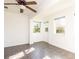 Sun-filled room with tile flooring, bright white walls, and multiple windows to enjoy the views at 3346 Gorse Ct, Palm Harbor, FL 34684