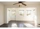 Open living space featuring ceramic tile, a ceiling fan, and abundant natural light at 3346 Gorse Ct, Palm Harbor, FL 34684