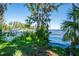 Picturesque waterfront view with dock and lush vegetation creating a serene setting at 3346 Gorse Ct, Palm Harbor, FL 34684