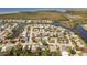 Breathtaking aerial view of a waterfront community with serene canals and lush landscaping at 3352 Honeymoon Ln, Holiday, FL 34691