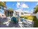 Beautifully landscaped backyard with patio, fire pit, and plenty of space for outdoor activities at 3352 Honeymoon Ln, Holiday, FL 34691