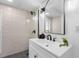 Updated bathroom features a glass shower with modern fixtures and vanity at 3352 Honeymoon Ln, Holiday, FL 34691