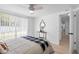 Bright bedroom featuring natural light, a decorative table, and a view of the outdoors at 3352 Honeymoon Ln, Holiday, FL 34691
