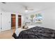 Bright bedroom features a cedar closet, large window, and neutral decor for a tranquil retreat at 3352 Honeymoon Ln, Holiday, FL 34691