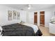 Well-lit bedroom showcasing cedar closets, minimalist artwork, and a comfortable queen-sized bed at 3352 Honeymoon Ln, Holiday, FL 34691