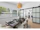 Dining room features a formal dining table with a barn door to another room at 3352 Honeymoon Ln, Holiday, FL 34691