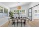 Dining room features a formal dining table with view to the exterior at 3352 Honeymoon Ln, Holiday, FL 34691