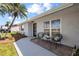 Inviting front porch with seating area and decorative accents; perfect curb appeal at 3352 Honeymoon Ln, Holiday, FL 34691