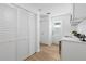 Hallway features ample storage and natural light from a nearby exterior door at 3352 Honeymoon Ln, Holiday, FL 34691