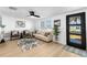 Cozy living room featuring modern decor, neutral tones, and bright light at 3352 Honeymoon Ln, Holiday, FL 34691