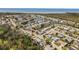 Aerial view of a waterfront community featuring a nearby body of water at 3352 Honeymoon Ln, Holiday, FL 34691