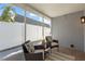 Relaxing screened porch with comfortable seating and views of the backyard at 3352 Honeymoon Ln, Holiday, FL 34691