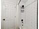 Tiled tub and shower combination with white subway tiles and contrasting black hardware at 3823 W Obispo St, Tampa, FL 33629