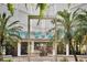 An inviting building entrance framed by tropical palms, showcasing architectural design at 470 3Rd S St # 622, St Petersburg, FL 33701