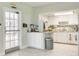 Bright kitchen features ample counter space and white cabinetry for a clean and modern look at 4885 1St Ne St # 305, St Petersburg, FL 33703