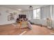 This is a living room that is staged with modern looking furniture and large windows with curtains at 4885 1St Ne St # 305, St Petersburg, FL 33703