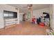 This living room is spacious and has tile flooring, a ceiling fan, and is full of furniture at 4885 1St Ne St # 305, St Petersburg, FL 33703