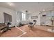 This is a living room with white walls, tile floors, curtains, a window, and a television at 4885 1St Ne St # 305, St Petersburg, FL 33703