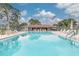 Large community swimming pool with lounge chairs at 4885 1St Ne St # 305, St Petersburg, FL 33703