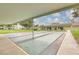 Outdoor shuffleboard court with shaded seating area at 4885 1St Ne St # 305, St Petersburg, FL 33703