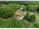 Expansive aerial shot showcasing the property's layout, surrounding greenery, and swimming pool at 4902 Five Acre Rd, Plant City, FL 33565