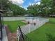 The backyard features an above-ground pool, white picket fence, and well-maintained lawn at 4902 Five Acre Rd, Plant City, FL 33565