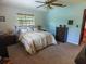 Bedroom featuring carpet, window, ceiling fan, and dresser at 4902 Five Acre Rd, Plant City, FL 33565