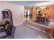 Open concept dining area with a raised platform, chandelier, and adjacent staircase at 4902 Five Acre Rd, Plant City, FL 33565