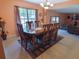 Spacious dining area featuring tile flooring, a chandelier, and natural light at 4902 Five Acre Rd, Plant City, FL 33565