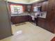 Well-lit kitchen with granite countertops, stainless steel appliances, and wooden cabinetry at 4902 Five Acre Rd, Plant City, FL 33565