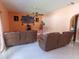 Inviting living room with leather recliners, ceiling fan, and mounted television at 4902 Five Acre Rd, Plant City, FL 33565