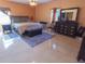 Spacious bedroom featuring tile floors, chandelier, and furniture at 4902 Five Acre Rd, Plant City, FL 33565