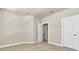 Bright, empty room with neutral walls, carpet, and baseboards, offering a clean and versatile space at 4965 Anniston Cir, Tampa, FL 33647