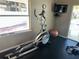 Well-equipped gym with elliptical machine and TV for workout entertainment at 4965 Anniston Cir, Tampa, FL 33647