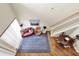 Aerial view of the living room showing the wood floors, stairway, furniture, and decor at 4965 Anniston Cir, Tampa, FL 33647