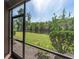 Screened patio offers serene views of the pond and lush greenery at 4965 Anniston Cir, Tampa, FL 33647