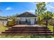 Beautiful house featuring a large, tiered wooden deck in the backyard, ideal for outdoor relaxation at 5108 N Suwanee Ave, Tampa, FL 33603