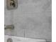 Close-up on a renovated bathroom showing modern tiles, vanity and tap at 5108 N Suwanee Ave, Tampa, FL 33603