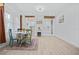 Dining room featuring a table set for four, with decor and an open concept to the kitchen at 5108 N Suwanee Ave, Tampa, FL 33603