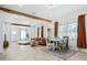 Bright open space with dining area featuring modern flooring, beam accents and ample natural light at 5108 N Suwanee Ave, Tampa, FL 33603