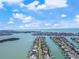 Aerial view of waterfront neighborhood with house, ocean, and canal at 556 Johns Pass Ave, Madeira Beach, FL 33708